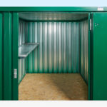 2m flatpack container with shelving on single side