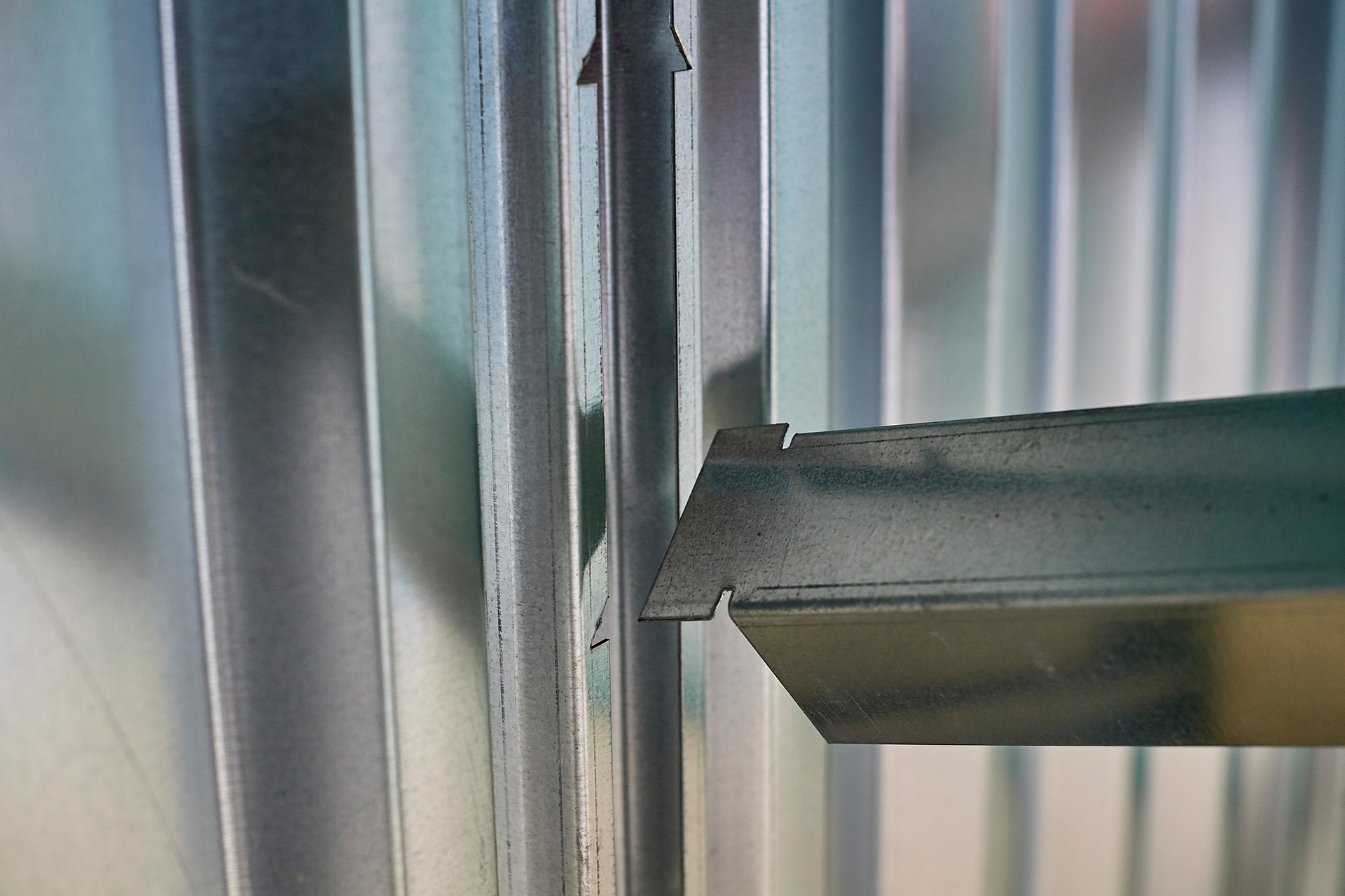 1282-flat-pack-shelving-fitting-arm-to-upright Flat Pack Container Shelving - Fitting Arm into Upright