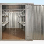 Two-tier shelving on both sides of 6m end linked flat pack store