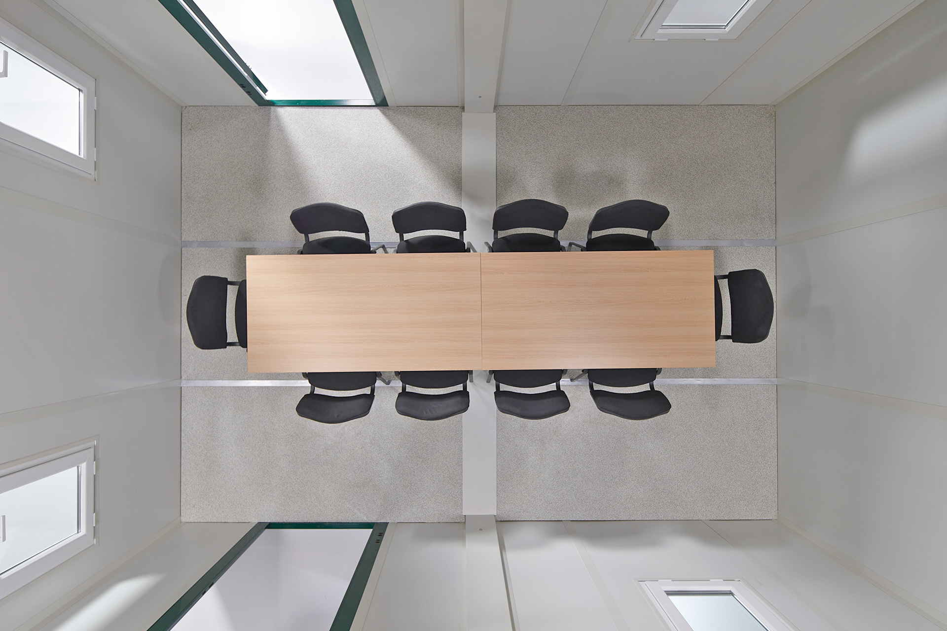 Boardroom table in a linked 3m flat pack office cabin