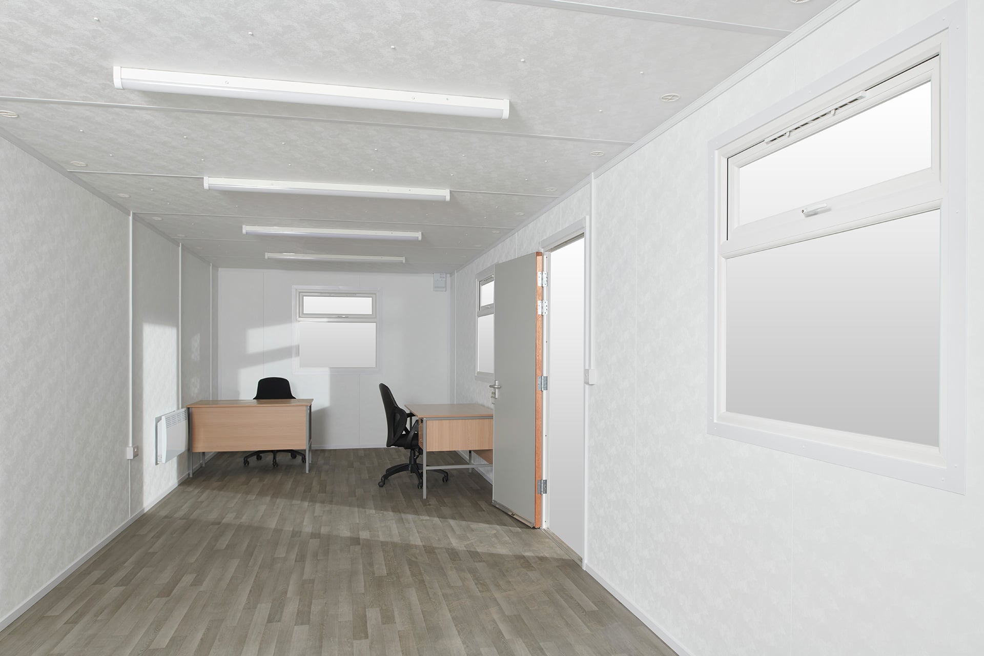 Desks at end of large portable site office