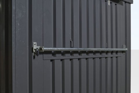 Locking bar to secure a hatch on a flatpack kiosk
