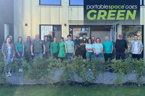 Portable Space team infront of office wearing green for our sustainability week